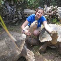 girl smiling with turtle in ecuador