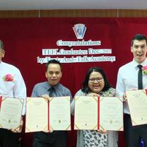 students holding certificates