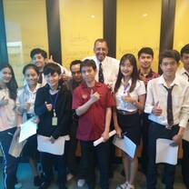students holding certificates in classroom
