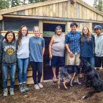 VISIONS group pauses for a moment to take a picture with some of our favorite community members