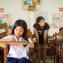 VISIONS participant helping out in a local school
