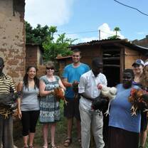 RWEYOWA volunteers donating chicken to a disadvantaged family for a sustainablity purpose.