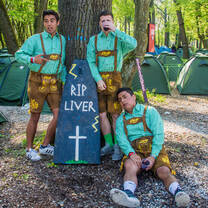 guys in leiderhosen at campsite