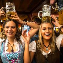 girls smiling with beer steins