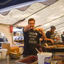 guy eating food in tent