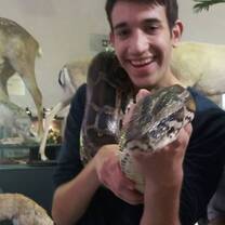 Male holds a snake