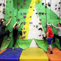 Male and females rock climb