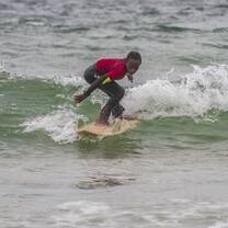 Surfer kid surfing a wave