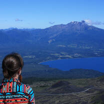 An explorer looks out over the mountains of Chile.
