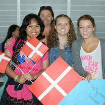 High school students holding Danish flags in Denmark.