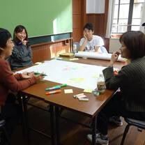 Kyoto Art Center participants and volunteers around the table working