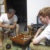 Playing igo with host family member