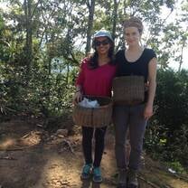 Harvesting coffee with a friend and parent of the school