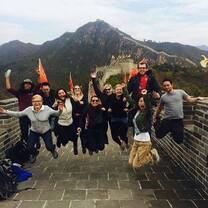 students jumping on the Great Wall