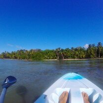 Habla Ya students paddle boarding in panama