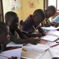 children on their tuition studies in the evening