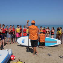 group getting Surfing lessons