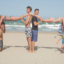 people making Human Towers on Alicante beach