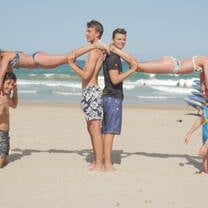people making Human Towers on Alicante beach