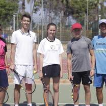 group playing tennis 