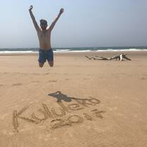man jumping in air on the beach 