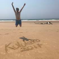 man jumping in air on the beach 