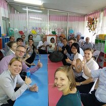 Get Paid to Teach English in Chiang Mai, Thailand people around a long table