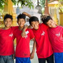 little kid volunteers in red shirts