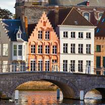 colorful buildings and bridge over canal in europe