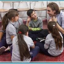 Teacher and students sitting together 