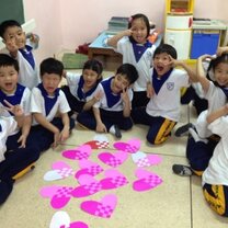 Get Paid to Teach English in Chiang Mai, Thailand students around a table with arts and crafts