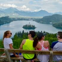 kids in Slovenia overlooking a lake and smiling