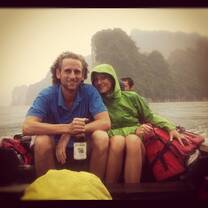 group with hoods on boat on river
