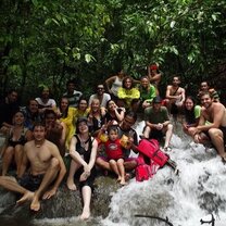 Get Paid to Teach English in Chiang Mai, Thailand group under trees next to waterfall