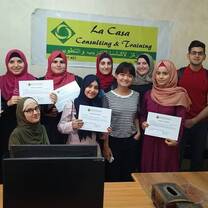 group of people handling a certificate