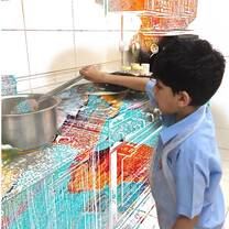 preschooler learning how to cook