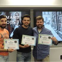 three men holding their certificate