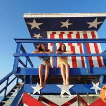 two ladies sitting on the top 