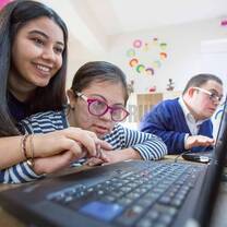 Two girl using laptop