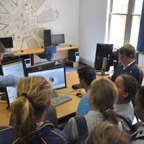 men and women learning in front of their computer