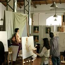 men and women on their painting session