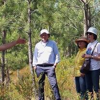 men and women in the middle of the forest