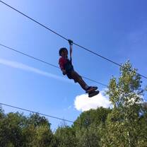 young girl in zipline