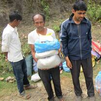 Man carrying 3 1/4 sack of something