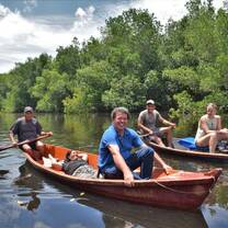 4 people riding in a boat