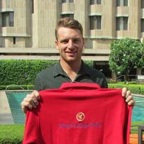Man holding a red shirt