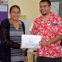 man giving a certificate to a girl