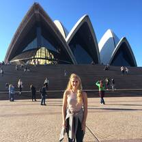 Woman posing in front of the Opera House.