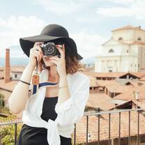 young lady wearing black hat