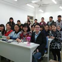 men and women inside a classroom